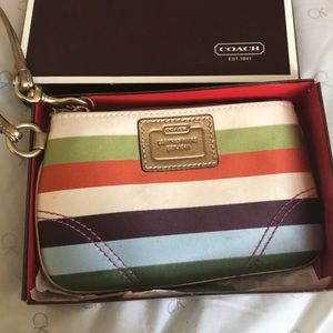 Gently used COACH wristlet with original box